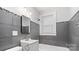 Modern bathroom with gray tile, updated vanity and fixtures, and a shower-tub combo at 331 5Th Se Ave, Hickory, NC 28602