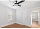 Bedroom with natural light, wood floors, ceiling fan, and two doorways at 331 5Th Se Ave, Hickory, NC 28602