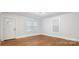 A well-lit bedroom featuring hardwood floors, neutral walls, and bright windows for a peaceful retreat at 331 5Th Se Ave, Hickory, NC 28602