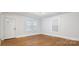 Well-lit bedroom with hardwood floors, neutral walls, and bright windows, offering a serene atmosphere at 331 5Th Se Ave, Hickory, NC 28602