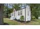Angle view of a beautifully landscaped home with black mulch and a brick-trimmed facade at 331 5Th Se Ave, Hickory, NC 28602