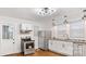 Well-lit kitchen showcasing stainless steel appliances, granite counters, and ample cabinet space at 331 5Th Se Ave, Hickory, NC 28602