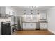 A bright kitchen showcasing stainless steel appliances, granite countertops, and ample cabinet space at 331 5Th Se Ave, Hickory, NC 28602