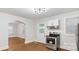 Bright kitchen featuring white cabinets, stainless steel appliances, and hardwood floors at 331 5Th Se Ave, Hickory, NC 28602