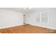 Hardwood floors fill this bright living room with access to the front door and view of the lush front yard at 331 5Th Se Ave, Hickory, NC 28602