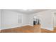 Open-concept living area featuring pristine hardwood floors and a seamless transition into the updated kitchen at 331 5Th Se Ave, Hickory, NC 28602