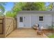 Backyard featuring a wooden deck, shed, and wooden gate, creating a private outdoor space at 3320 Eastwood Dr, Charlotte, NC 28205