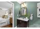 Elegant bathroom with a vanity sink, mirror, and decor, showcasing a clean and modern design at 3320 Eastwood Dr, Charlotte, NC 28205