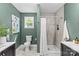 Stylish bathroom with a shower, toilet, and double vanity sinks, featuring a serene, spa-like ambiance at 3320 Eastwood Dr, Charlotte, NC 28205