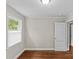 Well-lit bedroom featuring hardwood floors, white trim, and neutral paint at 3320 Eastwood Dr, Charlotte, NC 28205