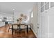Inviting dining area with modern furnishings, light walls, a kitchen view, and hardwood floors at 3320 Eastwood Dr, Charlotte, NC 28205