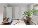 Close up of a home office desk, featuring a magnifying glass and foliage at 3320 Eastwood Dr, Charlotte, NC 28205