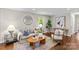 Comfortable living room featuring modern decor, a stylish coffee table, and an inviting seating arrangement at 3320 Eastwood Dr, Charlotte, NC 28205