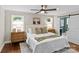 Well-lit main bedroom with wood floors, ceiling fan and ensuite bathroom at 3320 Eastwood Dr, Charlotte, NC 28205