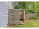 Private outdoor shower, featuring wood construction, a comfortable bench, and refreshing shower fixtures at 3320 Eastwood Dr, Charlotte, NC 28205