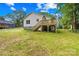 Home exterior showcasing a well-maintained lawn and the wooden deck and stairs at 404 S Greenbriar Rd, Statesville, NC 28625