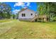 Home exterior showcasing a well-maintained lawn and the wooden deck and stairs at 404 S Greenbriar Rd, Statesville, NC 28625