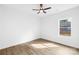 Bedroom featuring hardwood floors, a ceiling fan and a bright window at 404 S Greenbriar Rd, Statesville, NC 28625