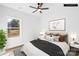 Staged bedroom featuring a large window providing natural light, and a ceiling fan at 404 S Greenbriar Rd, Statesville, NC 28625