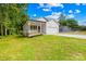 Charming single-Gathering home with a well-manicured lawn, complete with porch and two-car garage at 404 S Greenbriar Rd, Statesville, NC 28625