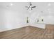 Bright living room features hardwood floors, vaulted ceilings, and large windows with scenic views at 404 S Greenbriar Rd, Statesville, NC 28625