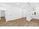 Bright living room features hardwood floors, vaulted ceilings, and open floor plan at 404 S Greenbriar Rd, Statesville, NC 28625