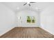 Bright living room features hardwood floors, vaulted ceilings, and large windows with scenic views at 404 S Greenbriar Rd, Statesville, NC 28625