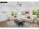 Bright living room features hardwood floors, vaulted ceilings, and large windows with scenic views at 404 S Greenbriar Rd, Statesville, NC 28625
