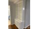 Hallway displaying custom-built shelving for storage solutions and access to the bathroom at 4100 Howie Cir, Charlotte, NC 28205