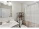 Bathroom featuring a vanity, toilet, and a shower with a striped curtain at 4205 Jones Creek Ln, Charlotte, NC 28215