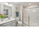 Bathroom featuring a shower with glass doors, vanity, and neutral paint at 4205 Jones Creek Ln, Charlotte, NC 28215