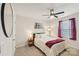 Bedroom featuring a ceiling fan, bed, and a hardwood floor at 4205 Jones Creek Ln, Charlotte, NC 28215