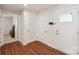 Bright foyer featuring hardwood flooring, white walls, and storage at 4205 Jones Creek Ln, Charlotte, NC 28215