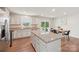Open kitchen with stainless steel appliances, granite countertops, and adjacent dining area at 4205 Jones Creek Ln, Charlotte, NC 28215