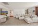 Comfortable living room with plush sectional sofa, soft lighting, and view of the foyer at 4205 Jones Creek Ln, Charlotte, NC 28215