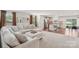 Spacious living room with plush carpeting, neutral decor, and view of the modern kitchen at 4205 Jones Creek Ln, Charlotte, NC 28215