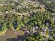 Gorgeous community aerial showcasing homes nestled amongst trees, with waterfront properties and stunning lake views at 444 Snapdragon Dr, Clover, SC 29710