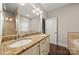 Bright bathroom showcasing double vanity with granite countertop and framed mirror at 444 Snapdragon Dr, Clover, SC 29710