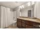 Stylish bathroom showcasing a double sink vanity and shower with curtain at 444 Snapdragon Dr, Clover, SC 29710