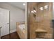 Luxurious bathroom featuring a tiled shower with built-in seat and a soaking tub at 444 Snapdragon Dr, Clover, SC 29710