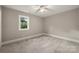 Neutral bedroom featuring carpeted floors, window, and ample natural light at 444 Snapdragon Dr, Clover, SC 29710