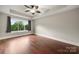 Serene primary bedroom with a tray ceiling, hardwood floors, and plenty of natural light at 444 Snapdragon Dr, Clover, SC 29710