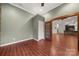 Spacious room with wood-look tile, a wood door and a view into the living room at 444 Snapdragon Dr, Clover, SC 29710