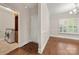 Inviting entryway leading to the laundry room and a living space with wood flooring at 444 Snapdragon Dr, Clover, SC 29710