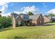 Charming two-story home with a combination of brick and stone exterior, set on a well-manicured lawn at 444 Snapdragon Dr, Clover, SC 29710