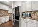 Stylish kitchen featuring stainless steel appliances, granite counters, and white cabinetry at 444 Snapdragon Dr, Clover, SC 29710