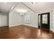 Bright living room with hardwood floors, neutral paint, large windows, and modern chandelier at 444 Snapdragon Dr, Clover, SC 29710