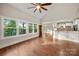 Bright living room featuring large windows, hardwood floors, and an open layout at 444 Snapdragon Dr, Clover, SC 29710