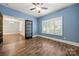 Stylish living room featuring hardwood floors, a ceiling fan, and plenty of natural light at 444 Snapdragon Dr, Clover, SC 29710
