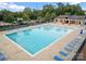 A refreshing community swimming pool is surrounded by lounge chairs and lush landscaping at 444 Snapdragon Dr, Clover, SC 29710